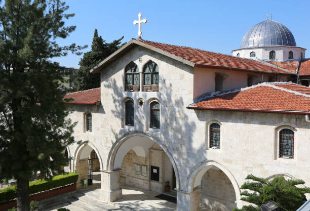 Greek Orthodox Church with Cross and  Dome in Hatay Old Greek Orthodox Church with Cross and Blue Sky in Hatay, Turkey greek orthodox stock pictures, royalty-free photos & images