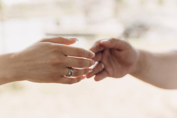 istock Hands of bride and groom with wedding rings 1466322315