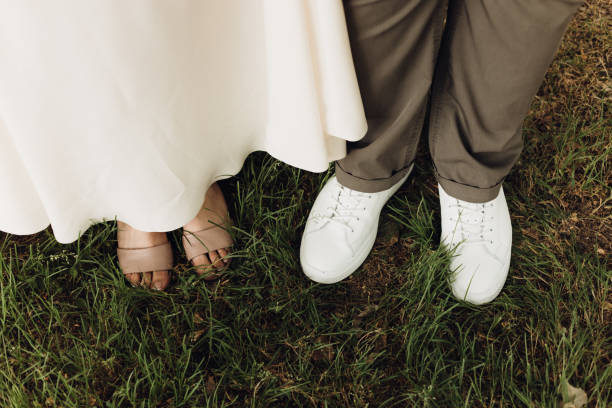 istock Feet of bride and groom on the grass 1466322326