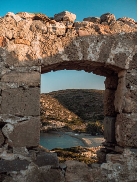 istock Old stone arch overlooking the azure sea 1466324099