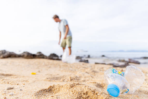 istock Man beach cleaning in Thailand 1466325499