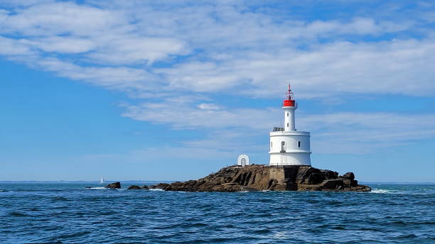 istock White lighthouse in the sea during the daytime 1466326340