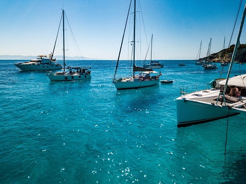 Paxos, Greece – July 04, 2022: Friends xailing in the mediteranean. Catamaran. Greece, Ionian