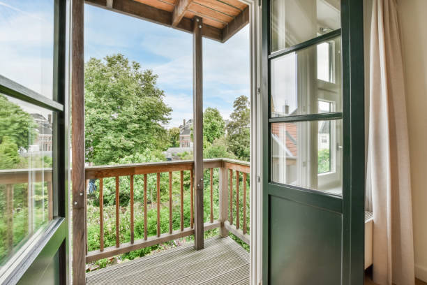 istock Balcony with a city view, trees, and houses 1466328903