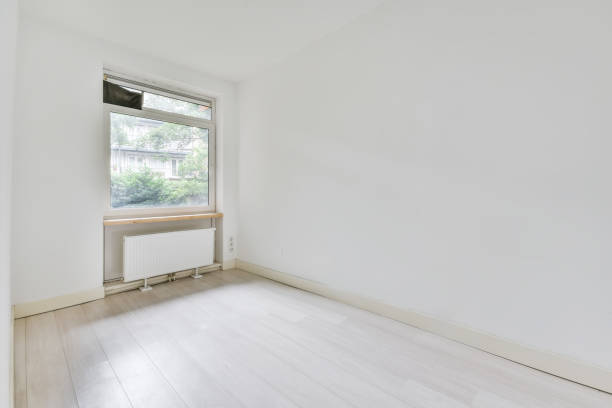istock Beautiful image of an empty room with a heating radiator and window in a white interior design house 1466329042
