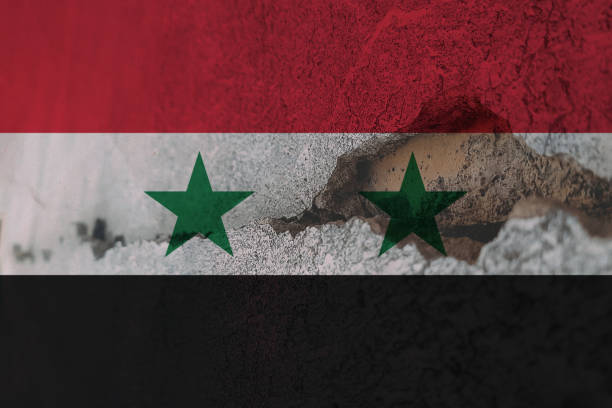 istock Syria flag on cracked wall. Earthquake or drought concept 1466331699