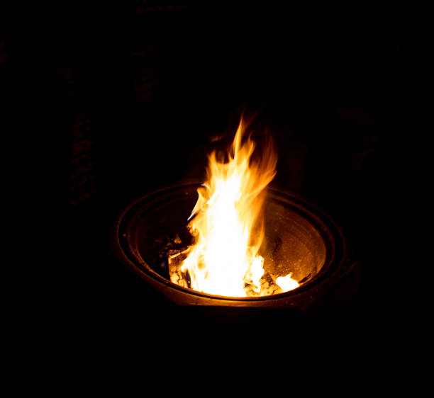 istock Fire burning in a bucket on a dark background 1466332690