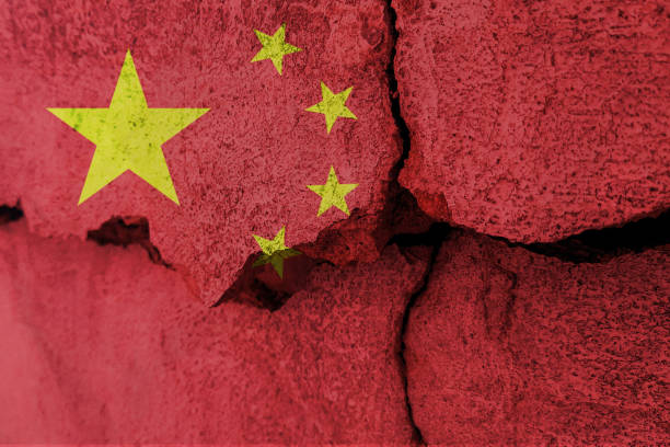 istock China flag on cracked wall. Earthquake or drought concept 1466333996