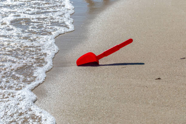 A view of a playing shovel on the beach