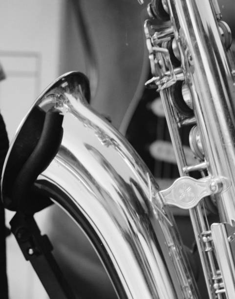 istock Grayscale shot of a saxophone under the lights with a blurry background 1466334610