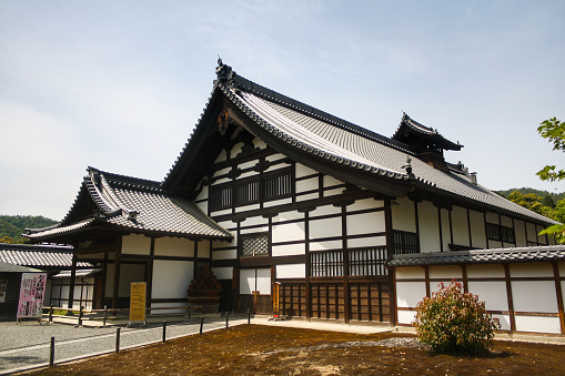 Kyoto, Japan - May 2014: The Kuri or priest quarters building exterior at Kinkaku-ji Temple with clear blue sky background. No people.