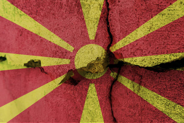 istock North Macedonia flag on cracked wall. Earthquake or drought concept 1466339174