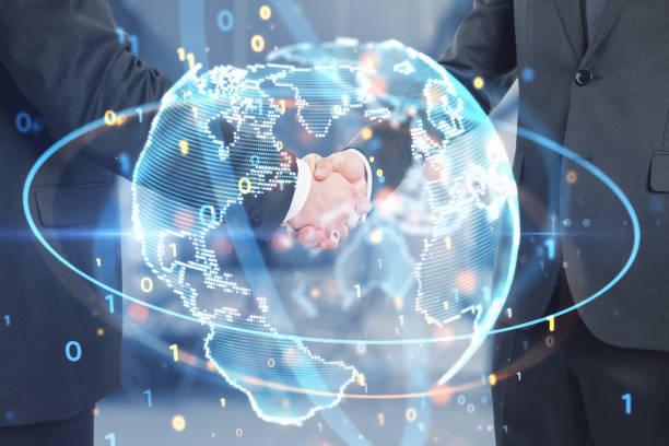 istock Close up of businessmen shaking hands with glowing planet and binary code hologram on blurry office interior background. Teamwork concept. Double exposure. 1466342648