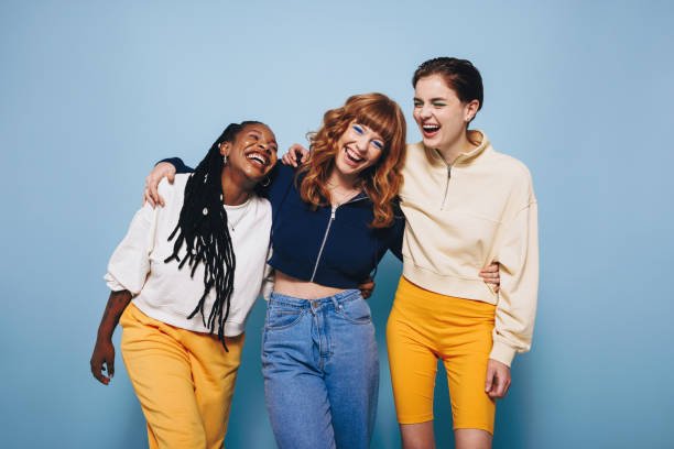 istock Diverse female friends laughing and having a good time while embracing each other 1466345631