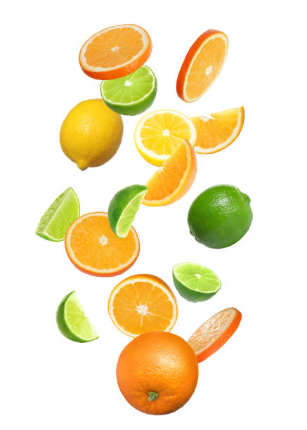 istock Different fresh citrus fruits and leaves falling on white background 1466349026