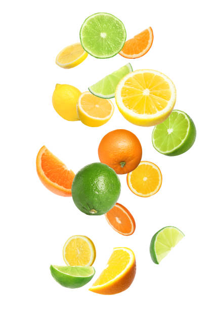 istock Different fresh citrus fruits and leaves falling on white background 1466349102
