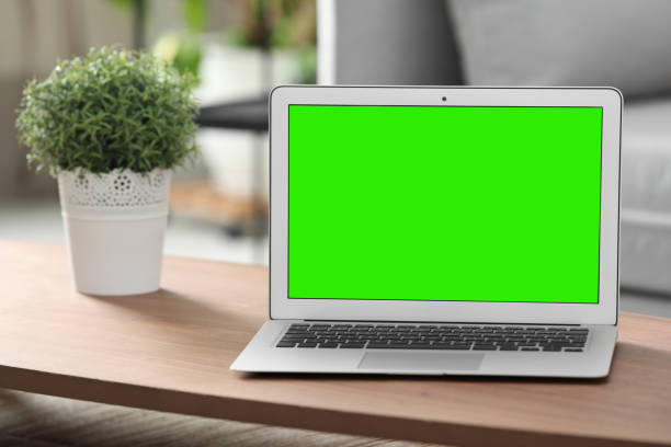 istock Laptop display with chroma key on desk in room 1466349432