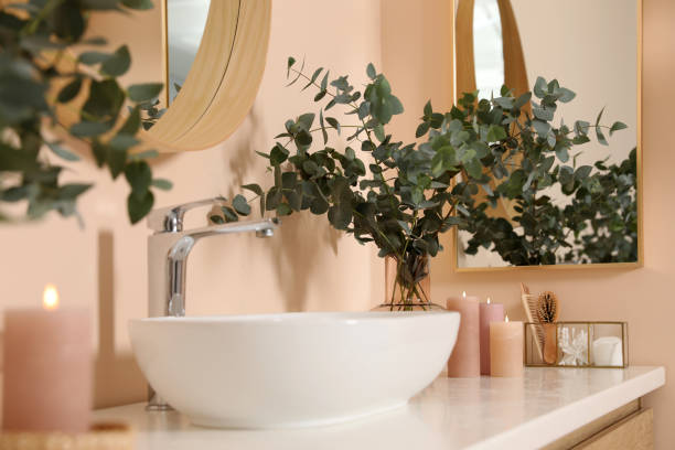 istock Eucalyptus branches near vessel sink on bathroom vanity. Interior design 1466349581