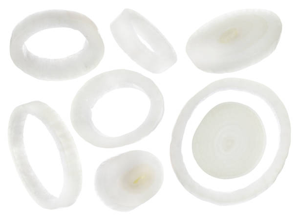 istock Fresh raw onion rings falling on white background 1466351333