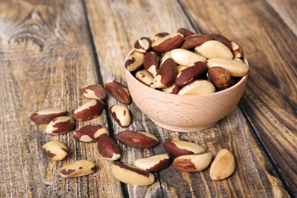 istock Many delicious Brazil nuts on wooden table 1466351493