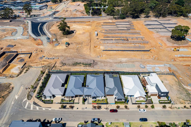 istock Aerial view display homes with construction earthworks preparing for new dwellings. 1466354345