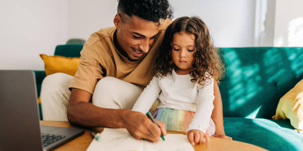 istock Loving single father teaching his daughter how to draw at home 1466355976