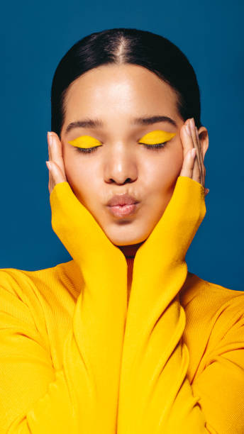 istock Makeup confidence: Woman embraces face with eyeshadow 1466356280