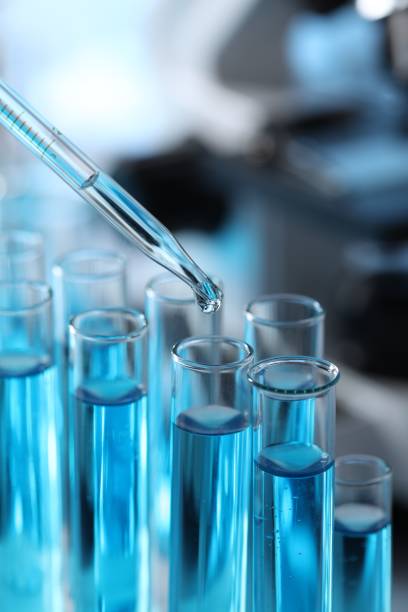 istock Dripping liquid from pipette into test tube in laboratory, closeup 1466362889