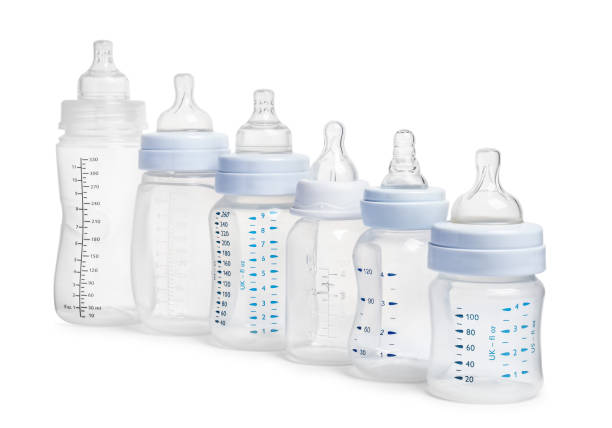 istock Many different empty feeding bottles for baby milk on white background 1466363449