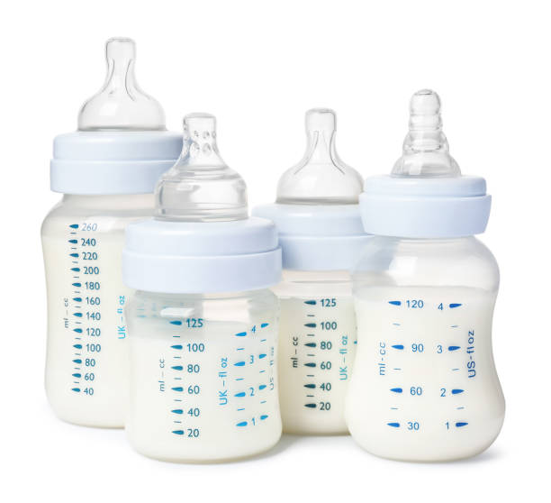 istock Many feeding bottles with infant formula on white background 1466364198