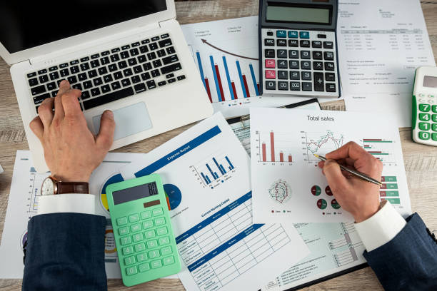 istock business man work with calculator at annual finance documents at office 1466364259