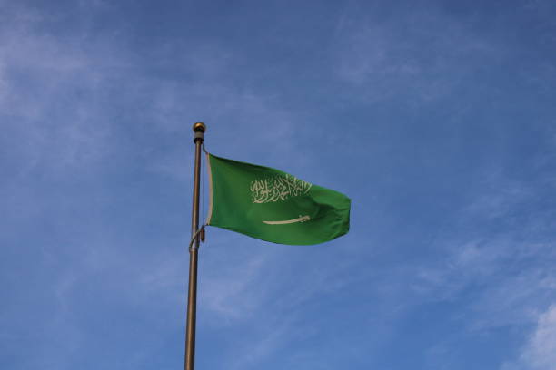 istock saudi arabia flag waving in the sky 1466364544