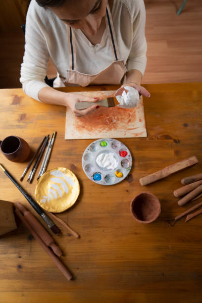 istock Woman painting a pottery 1466366036