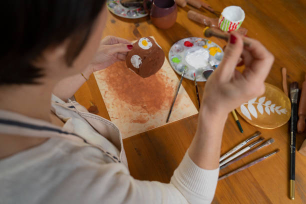 istock Woman painting a pottery 1466366166
