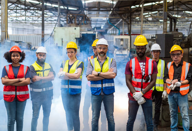 istock Team Workers and workers are standing in the factory. Workers working manufacturing plan in the factory. 1466373156