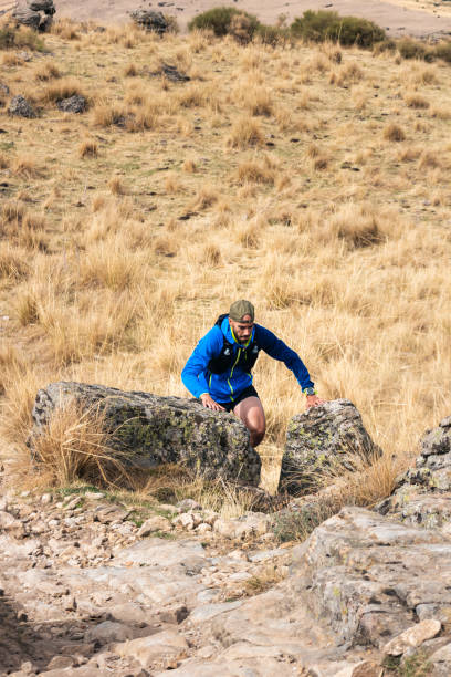 istock Young, sporty man practising trail running in the high mountains 1466374032