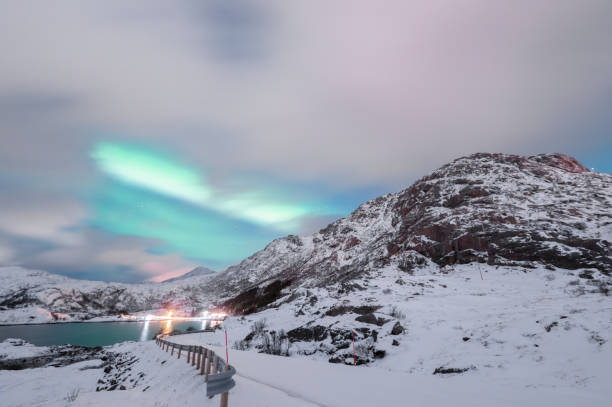 Northern Lights in winter landscape stock photo