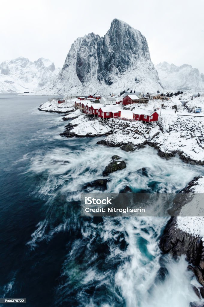 Hamnoy town under heavy snow Hamnoy town under heavy snow with high wind Mountain Stock Photo