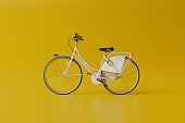 White bicycle on a yellow background.