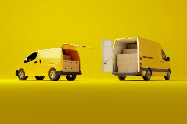 istock Two commercial delivery yellow vans with cardboard boxes on yellow background. 1466376718