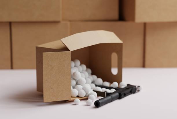 istock Cardboard boxes in the warehouse and one cardboard box that drops a submachine gun. 1466377905