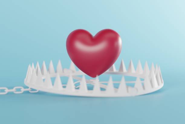 istock Heart over a snare, a trap on a dark background. 1466378049