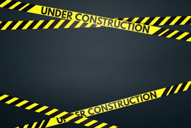 istock Yellow and black warning stripes with the inscription Under Construction. 1466380536