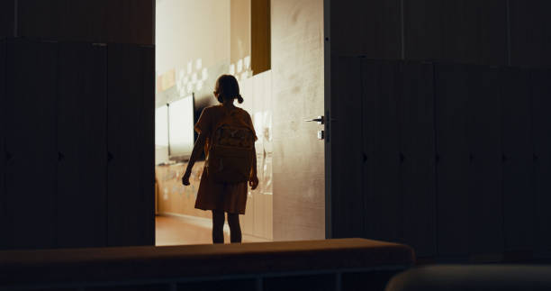 istock Little girl running down empty school staircase alone. Child rush to classroom. 1466380541