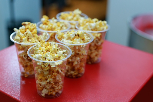Popcorn party food in transparent plastic cups