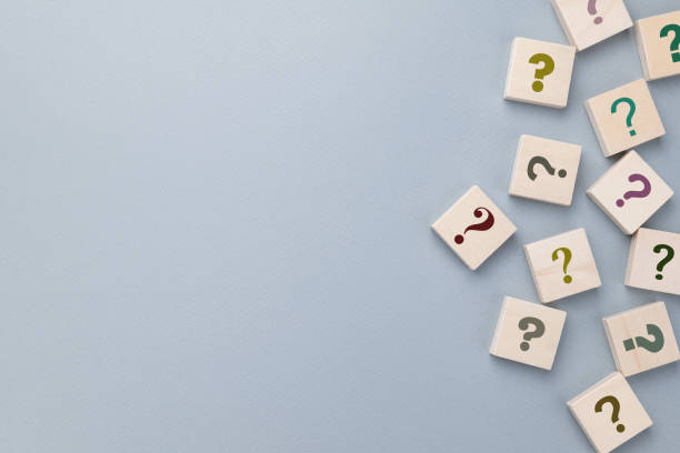 istock Many question mark signs on gray background 1466380918