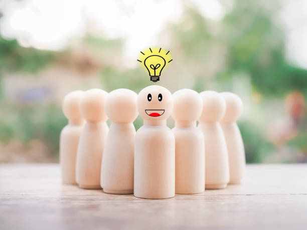istock Wooden business figure with light bulb for leadership, creative, idea, innovation concept. 1466382925