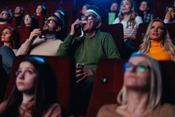 istock Audience watching intense movie in theater. 1466383351