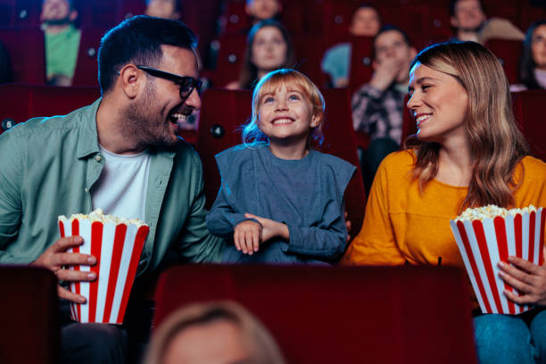 istock Joyous parent with child in cinema. 1466383387