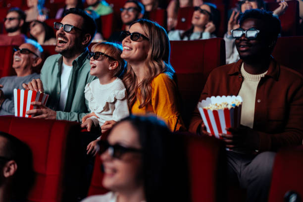 istock Cheerful people watching 3D movie. 1466383388